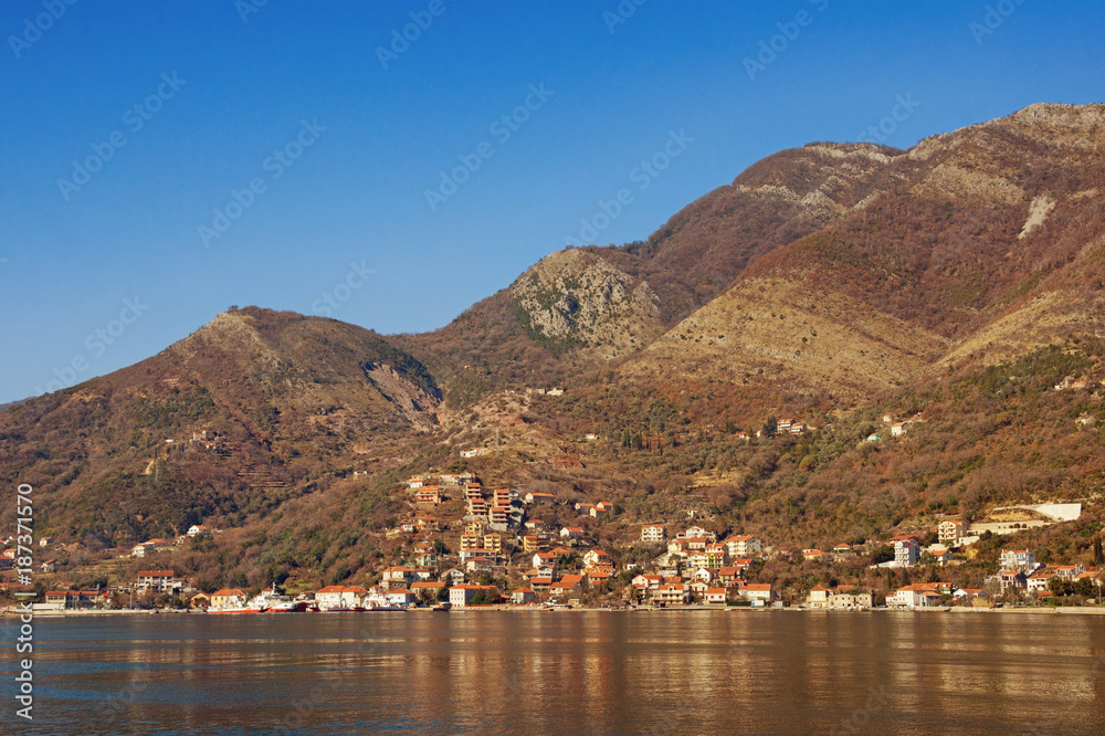 Brown and blue landscape. Bay of Kotor (Adriatic Sea), Kamenari village, Montenegro. Free space for text