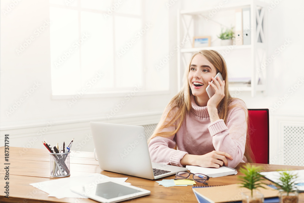 Business talk, woman consulting by phone at office Business talk, woman consulting by phone at office