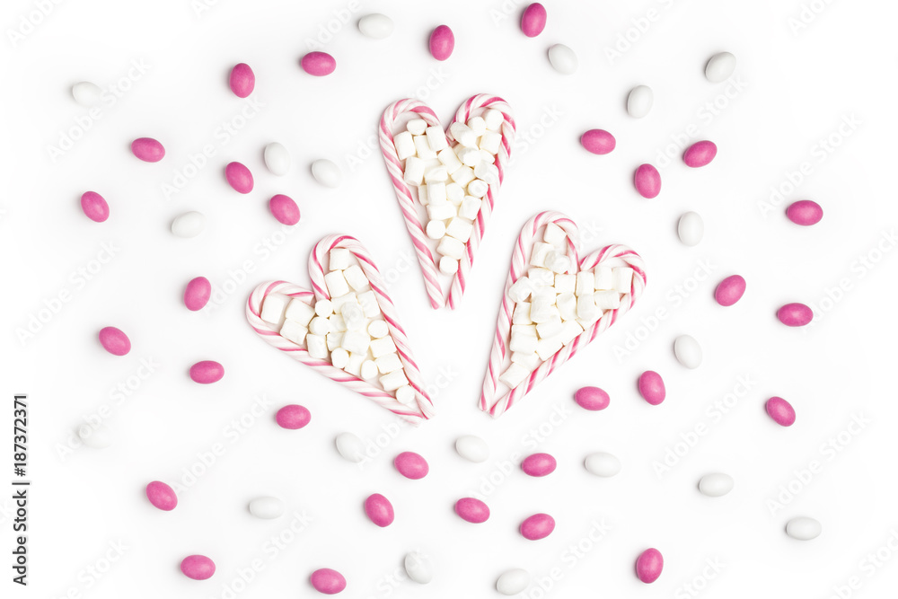 Pink and White candies and lollipops Top view White Background Valentine's Day Pink and White candies and lollipops Top view White Background Valentine's Day