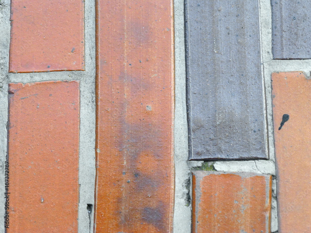 Dirty old tiles of two different colors 