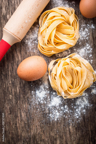 Raw pasta tagliatelle and eggs