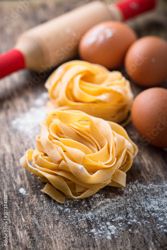 Raw pasta tagliatelle and eggs