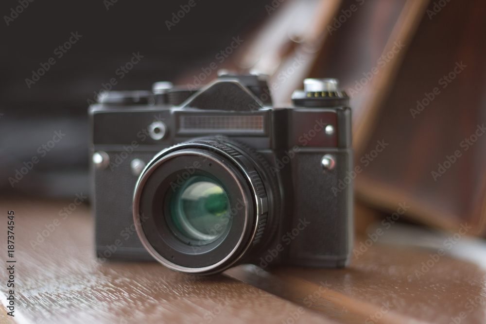 vintage camera on wooden background