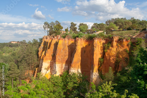 Colorful orange cliffs showing ochre rocks in french village of Roussillon