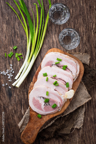 Slices of bacon with green onion and garlic  photo