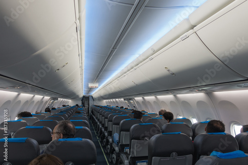 Airplane interior with passengers aboard