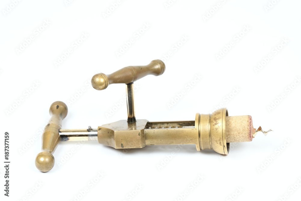 Mechanical corkscrew, bottle screw, cork of red wine, white background.