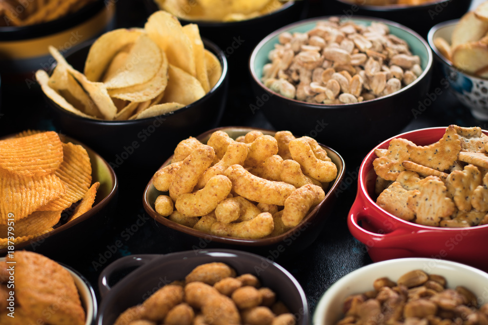 Salty snacks served in bowls Salty snacks served in bowls
