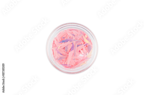 Decor for exquisite fashionable stylish manicure. A tool for manicure called "broken glass". The most gentle and light shade of pink in a small glass jar. Decorative fragments.