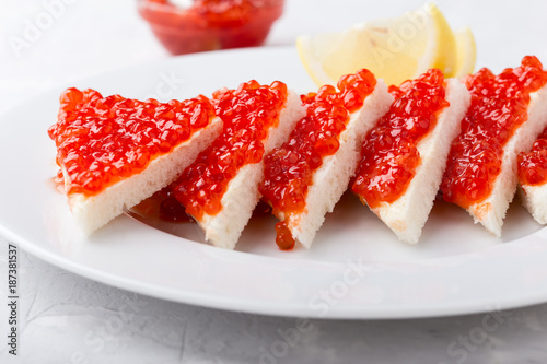 Red salmon caviar served on toast