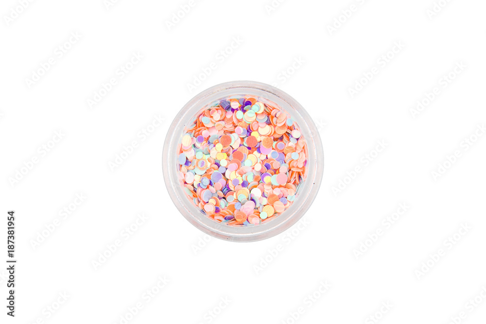 Confetti for manicure. Round beautiful sequins for nail design in manicure and pedicure. Decorative particles. Fish scales for decoration. Pink, purple, coral, blue in a small glass jar.