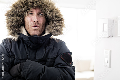 Man With Warm Clothing Feeling The Cold Inside House