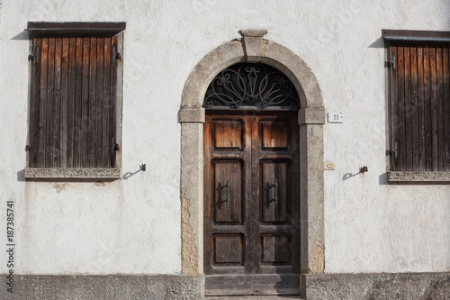 Old wooden doors with beautiful metal handles. © makedonskii