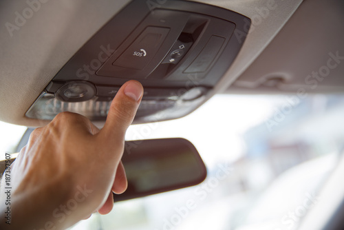 Tableau sur toile Man's finger pressing emergency sos button to contact with call center to ask fo