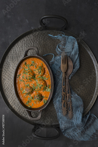 Overhead view of curry against slate background