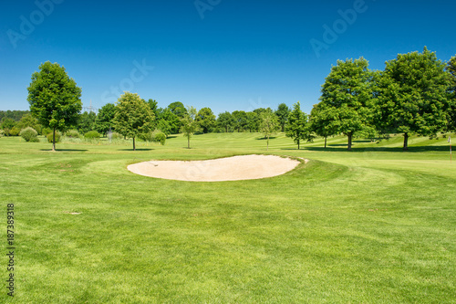 Fototapeta Naklejka Na Ścianę i Meble -  Golf course Landscape green field beautiful blue sky