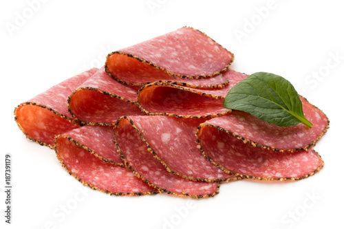 Salami slices isolated on the white background.