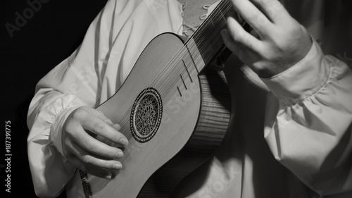 Man playing spanish renaissance instrument vihuela de mano