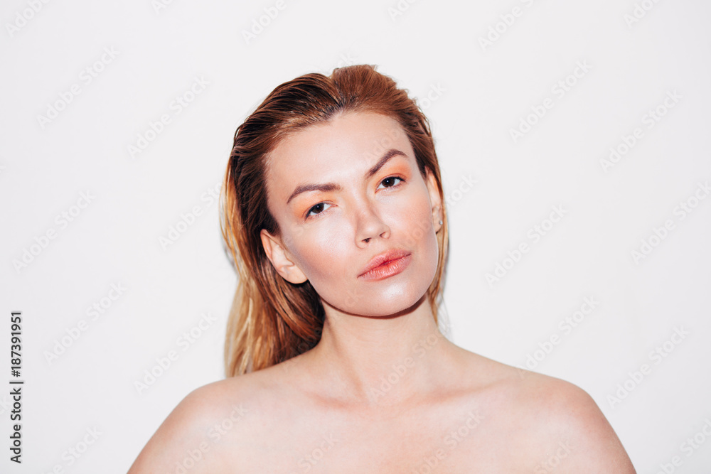 Portrait of a young woman against white background Portrait of a young woman against white background