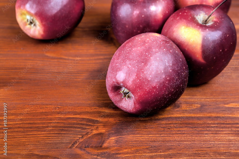 Ripe red apples on wooden background . Ripe red apples on wooden background .