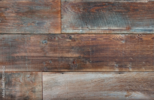 Section of three boards of reclaimed lumber.