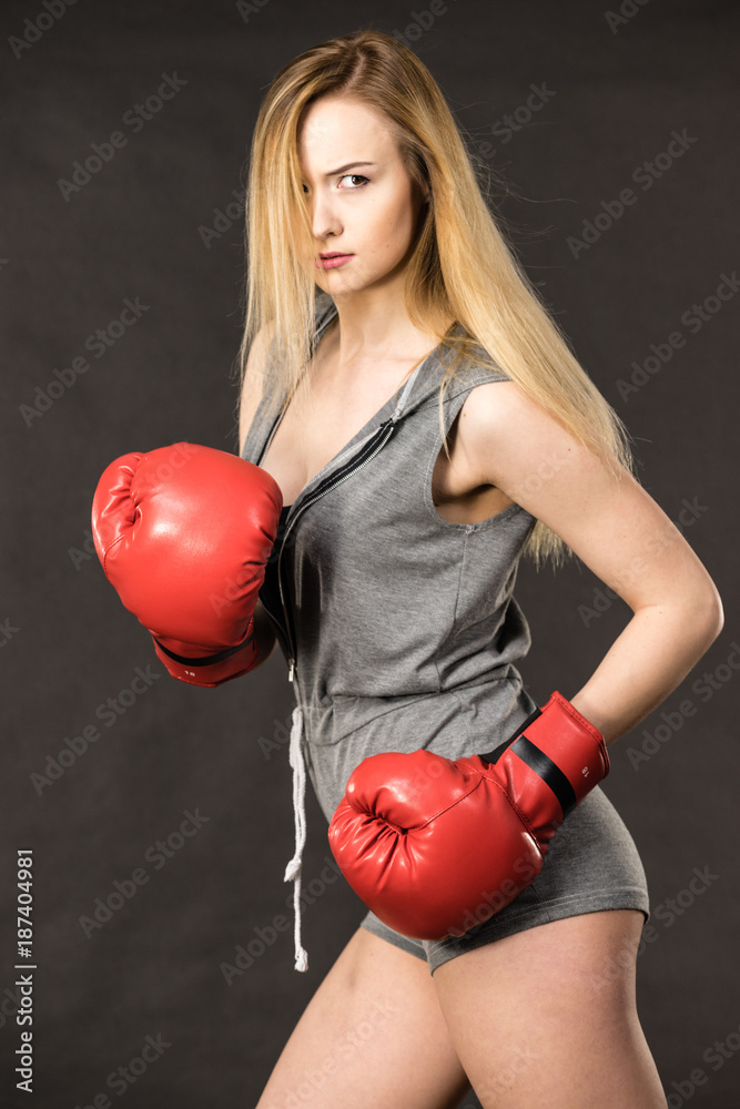 Beautiful woman with red boxing gloves Beautiful woman with red boxing gloves