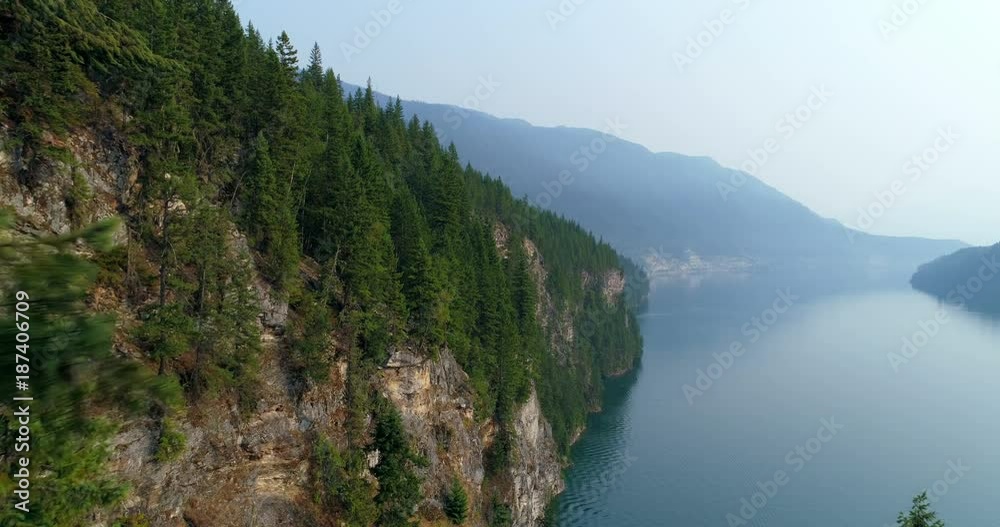Woman performing yoga on top of a mountain Woman performing yoga on top of a mountain