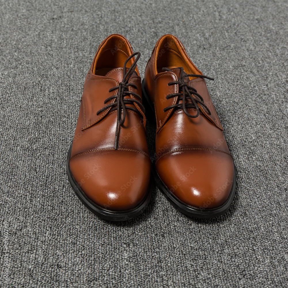 Brown men leather shoes closeup.