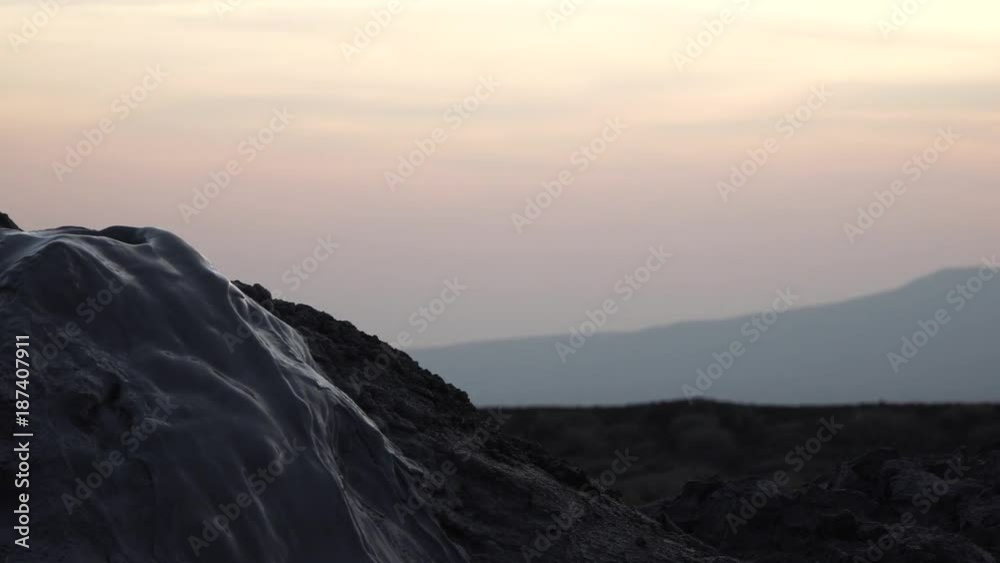 Mud volcano - a volcano with sulfur mud erupts from a muddy geyser. Wild landscape of Azerbaijan. Therapeutic mud. Mud volcano - a volcano with sulfur mud erupts from a muddy geyser. Wild landscape of Azerbaijan. Therapeutic mud.