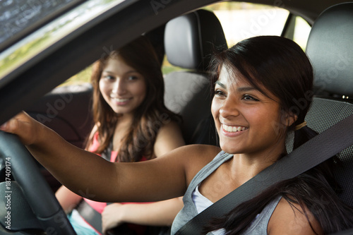 Friends driving taking a road trip.