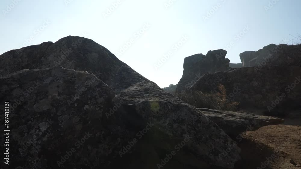 Gobustan is the national reserve of Azerbaijan. Petroglyphs of the ancient inhabitants of the planet. Ancient rock carvings, wild mountain landscapes, mountains and tourists. Gobustan is the national reserve of Azerbaijan. Petroglyphs of the ancient inhabitants of the planet. Ancient rock carvings, wild mountain landscapes, mountains and tourists.