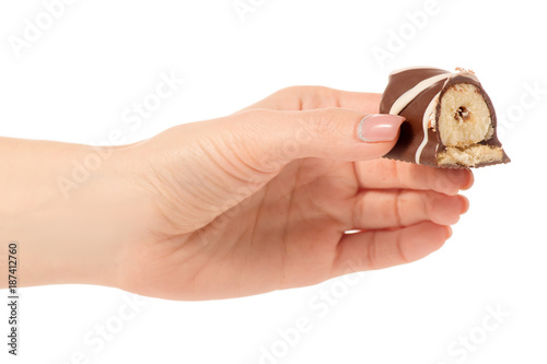 Cottage cheese curd in chocolate glaze in hand