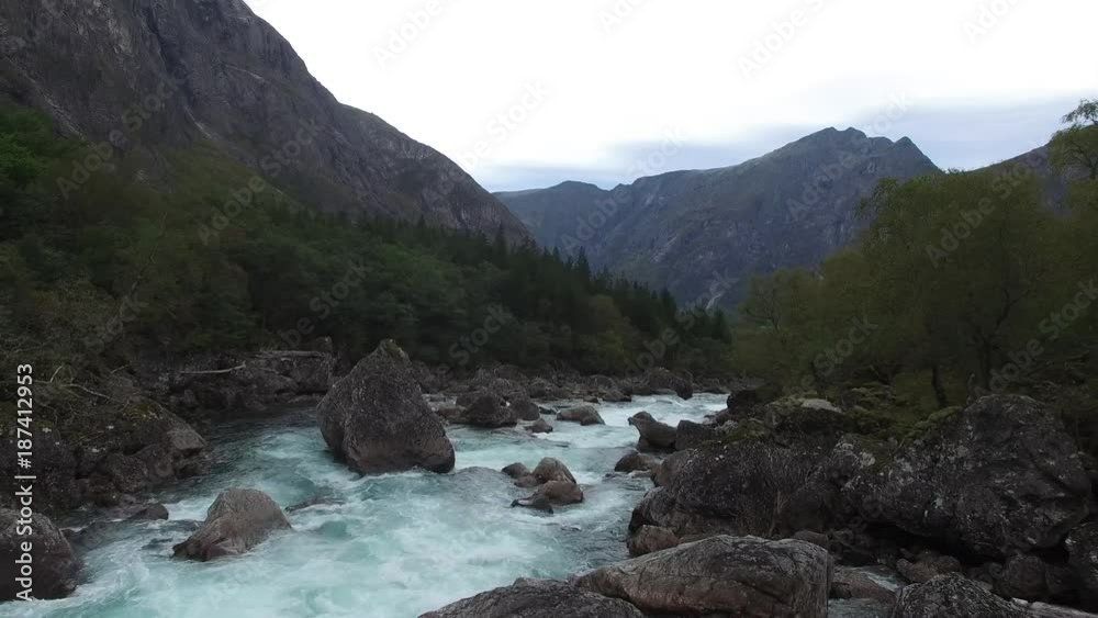 Backward moving drone shot of down stream river in Norway Backward moving drone shot of down stream river in Norway