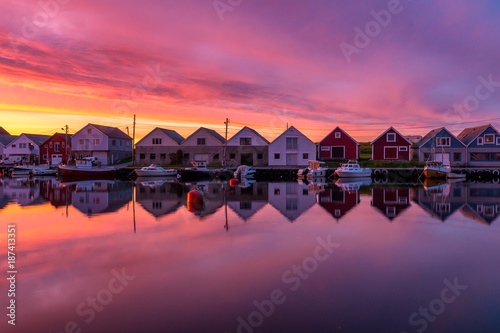 Boathouses in sunset. Location: Ferkingstad, Norway