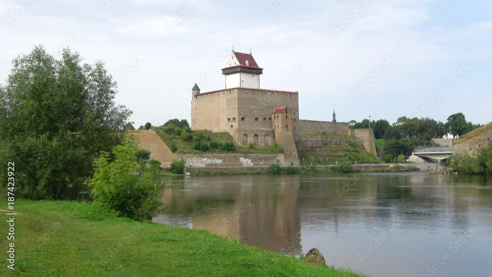 View on the Herman castle and Narva river on a day in august. Estonia View on the Herman castle and Narva river on a day in august. Estonia