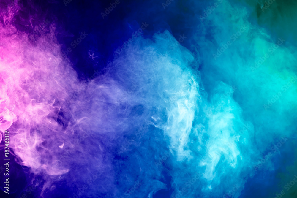 Colorful smoke clouds on dark background Colorful smoke clouds on dark background