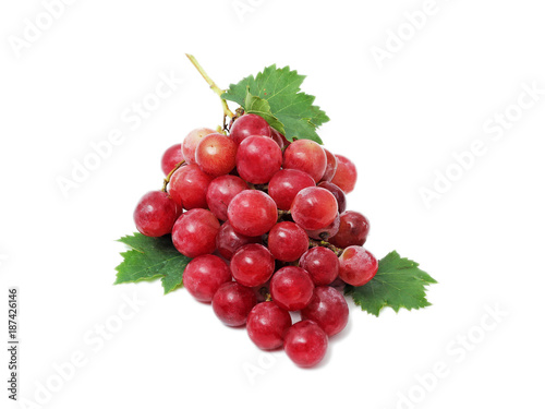 Ripe red grape. Pink bunch with leaves isolated on white. 
