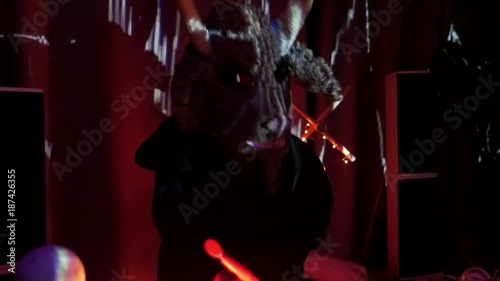 Halloween horror party. The scary DJ in mask playing music in private party.