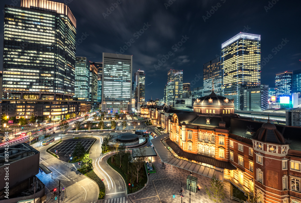 Tokyo railway station and Tokyo high-rise building  Marunouchi business district at twilight time