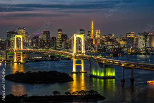 Beautiful night view of Tokyo Bay  Rainbow bridge and Tokyo Tower landmark Twilight scene  Odaiba  Japan