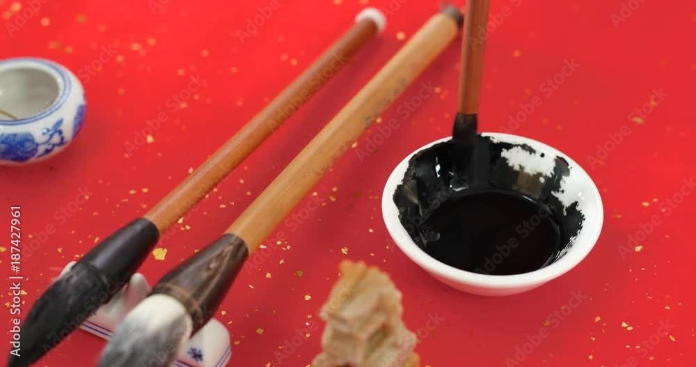 Chinese calligraphy writing tool on red paper Chinese calligraphy writing tool on red paper