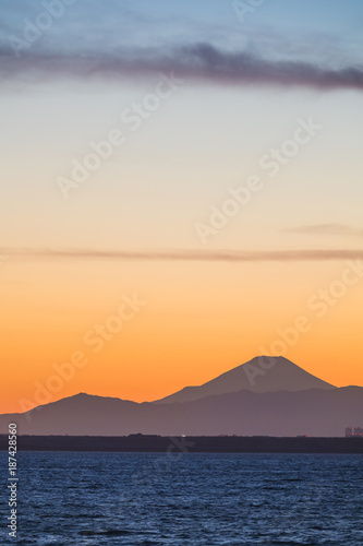 Mountain Fuji and Tokyo bay at sunset time in winter season.Tokyo Bay is a bay located in the southern Kanto region of Japan, and spans the coasts of Tokyo, Kanagawa Prefecture, and Chiba Prefecture.