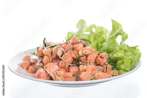 Salmon spicy salad with lemon grass isolated on white background