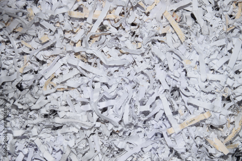 scraps of paper made in an office document shredder scraps of paper made in an office document shredder