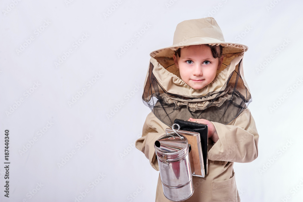 A little girl wears an over sized bee suit in studio white background. A little girl wears an over sized bee suit in studio white background.