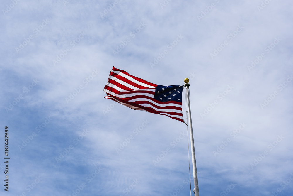 American Flag on the blue sky.