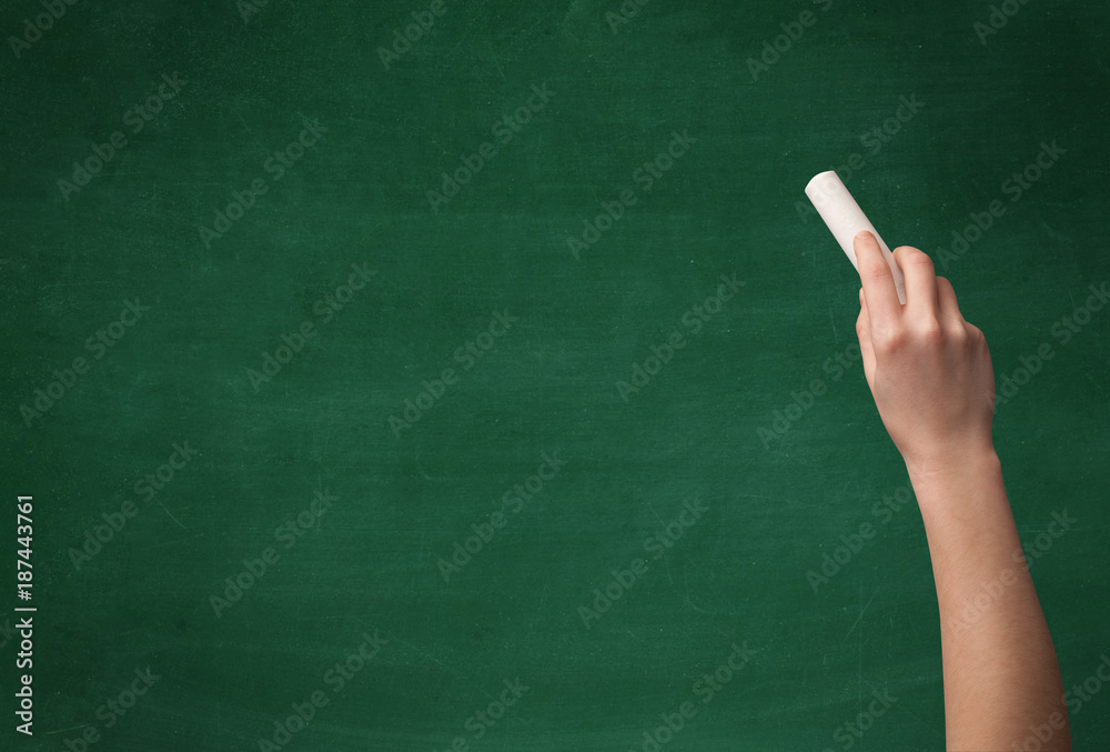 Hand writing on clean blackboard Hand writing on clean blackboard