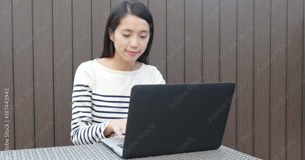 Woman watching on notebook computer Woman watching on notebook computer