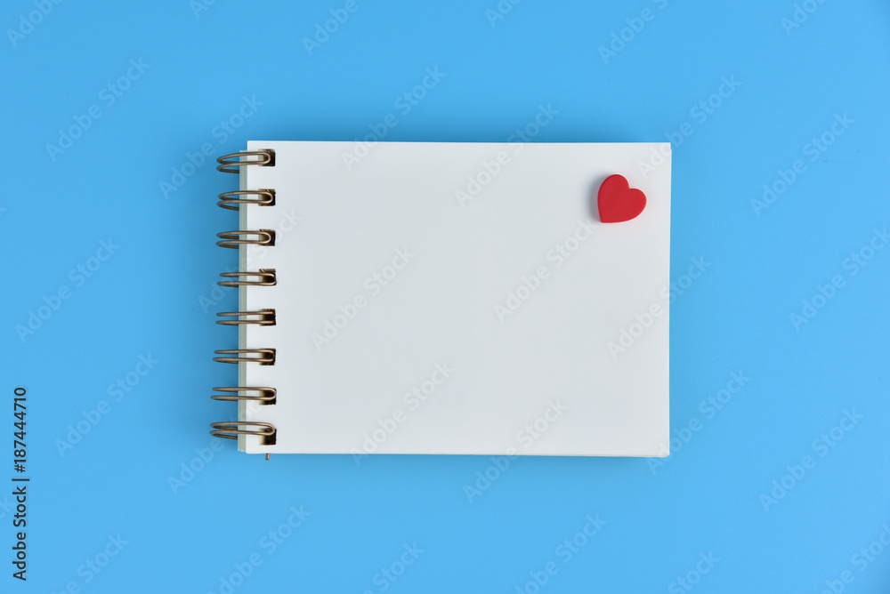 A Red heart with blank notebook. A Red heart with blank notebook.