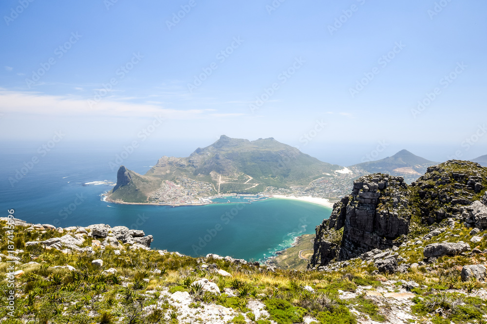 Panoramic view of Hout Bay, a town near Cape Town, South Africa, in a valley on the Atlantic seaboard of the Cape Peninsula. Seen from Silvermine Nature Reserve, part of Table Mountain National Park.